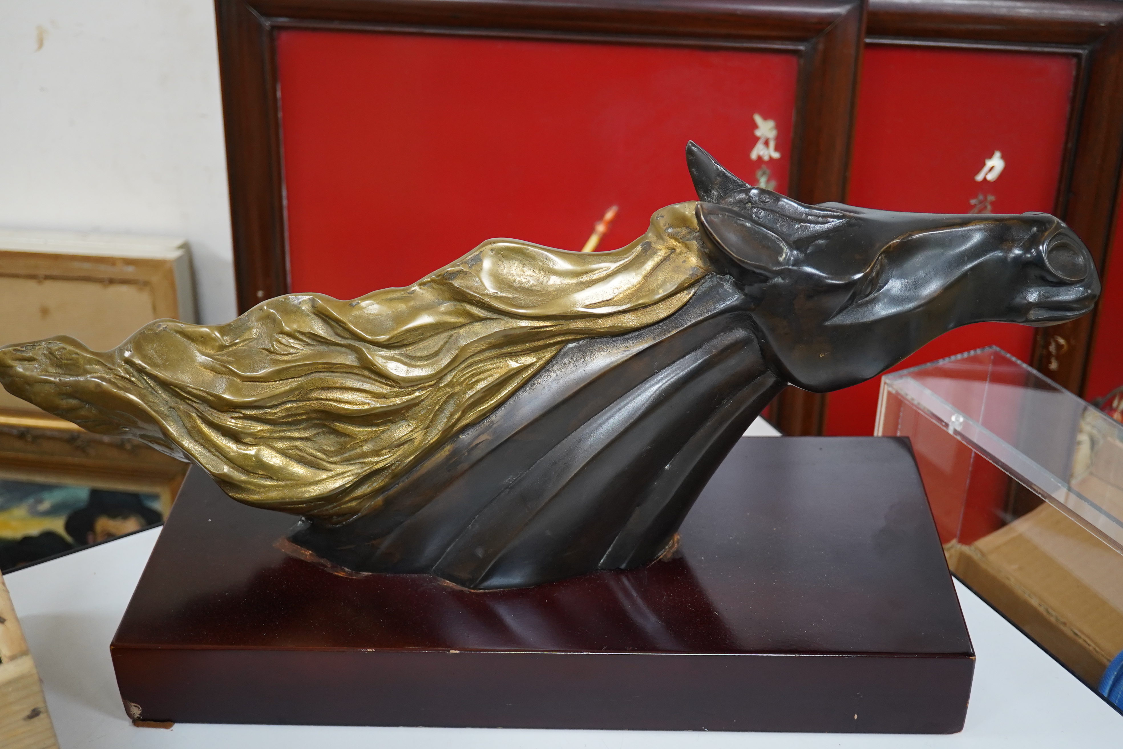 A French Art Deco patinated brass model of a horses head, unsigned, 60cm wide. Condition - fair to good